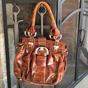 B. Makowsky leather handbag.